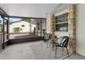 Relaxing screened lanai with comfortable seating and an outdoor view at 501 Benedict Ct, Casselberry, FL 32707