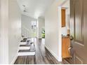 Bright entryway featuring hardwood floors, a staircase, and a view of the backyard through large windows at 1932 Westpointe Cir, Orlando, FL 32835