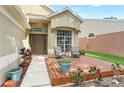 Inviting front porch with seating, potted plants, and a well-maintained walkway leading to the entrance at 1932 Westpointe Cir, Orlando, FL 32835