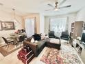 Open-concept living and dining area with modern furnishings, creating a stylish and functional space at 3118 Crown Jewel Ct, Winter Park, FL 32792