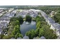 Aerial view of community with pond, fountain, and well-maintained landscaping at 335 Lansbrook Ln, Winter Springs, FL 32708