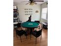 Game room featuring a round poker table with a brick base and a gaming chair at 3410 Calumet Dr, Orlando, FL 32810