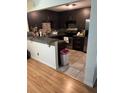 Modern kitchen with dark cabinets, stainless steel appliances, and a mosaic tile backsplash at 3410 Calumet Dr, Orlando, FL 32810