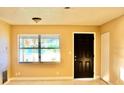 Bright living room with fresh paint and large window at 425 Walnut St, Daytona Beach, FL 32114