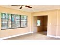Open-concept living space with a view of the attached additional room at 425 Walnut St, Daytona Beach, FL 32114