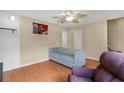 Comfortable living area featuring sleek furniture, wood floors, and neutral tones at 5662 Royal Pine Blvd # 24, Orlando, FL 32807