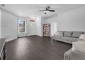 Comfortable living room with modern floors, a ceiling fan, and a neutral color palette, creating a welcoming space at 917 Dekleva Dr, Apopka, FL 32712