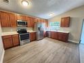 Spacious kitchen features stainless appliances, ample storage, and sleek countertops at 11500 Benbow Ct, Orlando, FL 32837