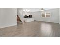 Open floorplan with sleek flooring, recessed lighting, and versatile space at 12015 Prologue Ave, Orlando, FL 32832