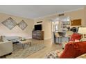 Cozy living room featuring neutral walls, hardwood flooring, and modern decor at 145 Oyster Bay Cir # 140, Altamonte Springs, FL 32701