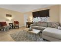 Comfortable living room with gray sofa, patterned chairs, and natural light at 145 Oyster Bay Cir # 140, Altamonte Springs, FL 32701