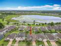 Aerial view of home near lake, showcasing nearby amenities and neighborhood layout at 1540 Orange Valley Rdg, Ocoee, FL 34761