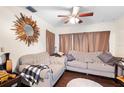 A comfortable living room featuring hardwood floors, decorative mirror and plenty of seating at 2044 W Gore St, Orlando, FL 32805