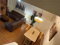 Overhead view of living room leading to dining room with hardwood floors and nice light at 223 Palermo St, Davenport, FL 33897