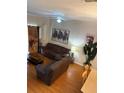 Comfortable living room features stylish decor, hardwood floors, and ceiling fan at 223 Palermo St, Davenport, FL 33897