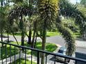 View from the condo balcony overlooking the street and a silver car parked at 25210 Northlake Dr # 210, Sanford, FL 32773