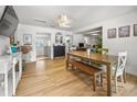 Bright dining area featuring a wooden table with bench, ceiling fan, and access to other rooms, perfect for Gathering gatherings at 330 N Stone St, Deland, FL 32720