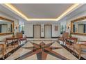 Elegant lobby with stylish seating, a starburst tile floor, and elevator access for a welcoming first impression at 400 E Colonial Dr # 1103, Orlando, FL 32803