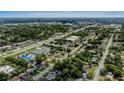 Wide aerial shot showcasing neighborhood, nearby commercial area, and major thoroughfare at 418 Tulane Dr, Altamonte Springs, FL 32714