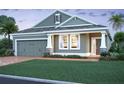 Charming single-Gathering home featuring a welcoming front porch, two-car garage, and well-maintained landscaping at 817 River Stone Trl, Sanford, FL 32771