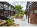Courtyard view featuring lush greenery and open walkways between units at 851 Miles Ave # 8, Winter Park, FL 32789