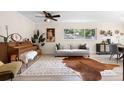 Bright living room featuring light wood floors, large windows, and modern furnishings at 105 Bilsdale Ct, Longwood, FL 32779