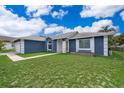 Beautiful single-story home with a well-kept lawn and inviting curb appeal at 1115 Marni Ridge Ct, Kissimmee, FL 34747