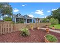 Charming blue two-story home with a manicured yard at 1407 S Palmetto Ave, Sanford, FL 32771