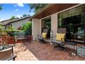 Cozy brick patio with comfortable seating, offering a relaxing outdoor space at 154 Golf Club Dr # 154, Longwood, FL 32779