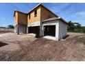 House under construction with visible concrete blocks and wooden framing, sitting on a dirt lot at 1646 Cane Bamboo Drive, St Cloud, FL 34771