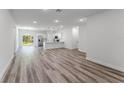 Bright, open living space flows into a modern kitchen, complete with wood flooring and plenty of natural light at 17301 Sw 41St Cir, Ocala, FL 34473