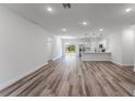 Bright and spacious living area with modern wood flooring seamlessly connecting to the open-concept kitchen at 17301 Sw 41St Cir, Ocala, FL 34473