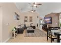 Spacious living room featuring tile flooring, ceiling fans, and comfortable seating arrangement at 182 Westmoreland Cir, Kissimmee, FL 34744