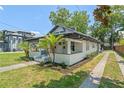 Charming single Gathering home with landscaped front yard and covered porch area at 314 E Harwood St, Orlando, FL 32801