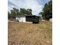 Fenced backyard with plenty of space and a view of the back side of the house at 337 Live Oak Blvd, Sanford, FL 32773