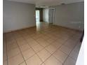 Open living room featuring neutral paint, ceramic tile flooring and an abundance of natural light at 337 Live Oak Blvd, Sanford, FL 32773