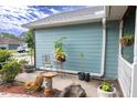Exterior view highlighting a charming side yard with stone and plants at 8718 Fort Shea Ave, Orlando, FL 32822