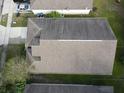 Aerial view of a single-Gathering home with a large backyard and neighboring properties in a residential area at 11236 Rouse Run Cir, Orlando, FL 32817