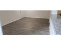Open concept living room with updated flooring and white trim at 11588 Westwood Blvd # 1523, Orlando, FL 32821