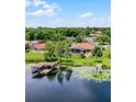Waterfront home in a quiet neighborhood featuring a private dock and serene lake views at 13626 Sunset Lakes Cir, Winter Garden, FL 34787