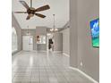 Bright living room featuring tile flooring, recessed lighting, and high ceilings at 1706 Terra Cota Ct, Orlando, FL 32825