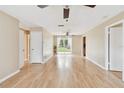 Open concept living room with sliding doors leading to the backyard at 191 Ruskin St, Lake Mary, FL 32746