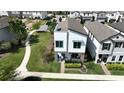 Stylish two-story house with well-kept lawn and a modern architectural style at 2035 White Feather Loop, Oakland, FL 34787