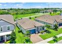 Aerial view of a well-maintained home with lush green surroundings in a desirable neighborhood at 2390 Standing Rock Cir, Oakland, FL 34787