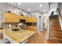 Well-lit kitchen with granite countertops, stainless steel appliances, and plenty of cabinet space at 2418 Ridgemooor Dr, Orlando, FL 32828