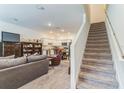 Spacious living room seamlessly flows into an open kitchen area, creating an inviting atmosphere at 3028 Water Sprite St, Orlando, FL 32808