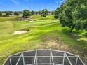 Enjoy the tranquil backyard view of this property overlooking a well-maintained golf course at 36730 Oconee Ave, Eustis, FL 32736