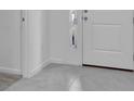 Inviting entryway featuring neutral tile flooring leading to other rooms of the house at 3756 Watercliff Cir, Grand Island, FL 32735