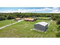 Wide aerial shot of the home, separate structure and spacious yard at 4160 Packard Avenue, St Cloud, FL 34772