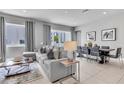 Comfortable living area with contemporary decor, tile flooring, and ample natural light at 7740 Sandy Ridge Dr # 124, Reunion, FL 34747
